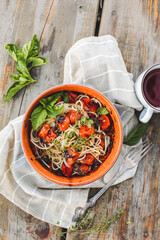 Spaghetti with minced meat and vegetables. top view, rustic style