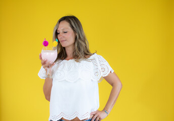 Beautiful woman in white shirt with a shake