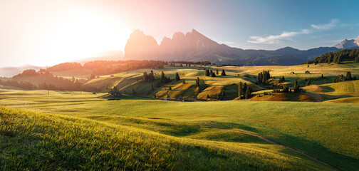 Stunning morning Scene. Majestic Moutain peak under sunlight, Alpe di Siusi valley during sunset. Amazing Nature Landscape. Awesome natural Background. Incredible colorful Scenery. Dolomites alps.