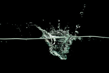 Water drinking, Water wave splash isolated black background.