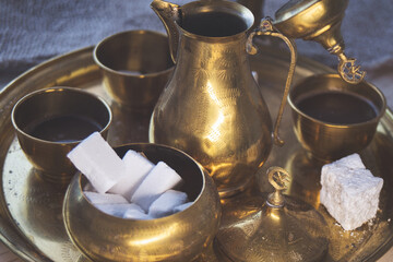 Delicious Bosnian coffee is served with rahat lokum dessert in traditional turkish coffee pot