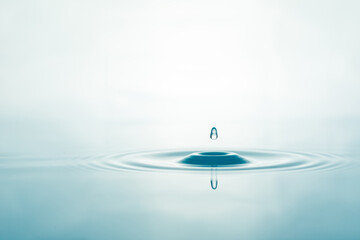 Water droplets on surface water background