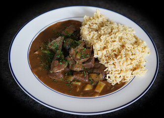 ready to eat - roasted heart and liver from a roe buck with rice and sauce