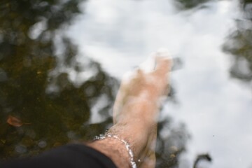 feet of person in the river