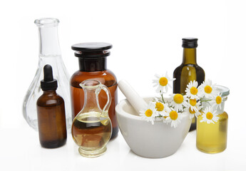 Composition of natural alternative medicine with oil, essence and plants.