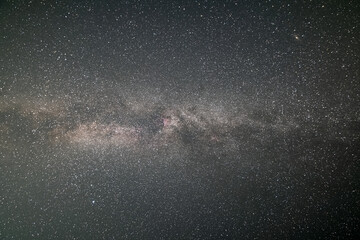 Black night stars covered sky with bright Milky Way galaxy.