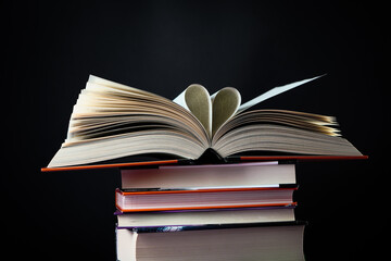 Open book on the table. It is time for education and therefore you need to go back to school.