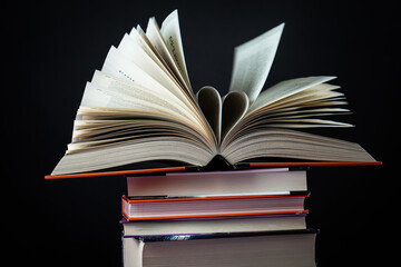 Open book on the table. It is time for education and therefore you need to go back to school.