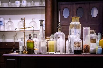 Santiago de Compostela, Spain - 10.16.2019: Medicine bottles on a table in a historic pharmacy in an old monastery.