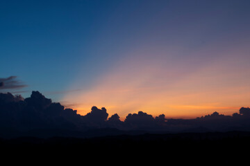 Land with and dramatic colorful sky at sunset