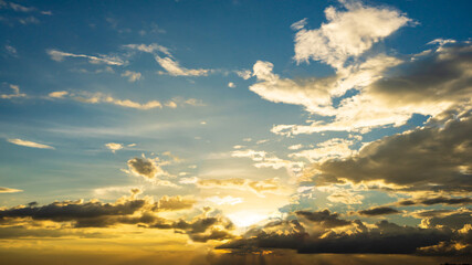 silhouette Men with women standing on the mountain with sunset in the evening.