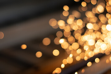 Gold abstract bokeh background, Festive xmas abstract background with bokeh defocused lights and stars
