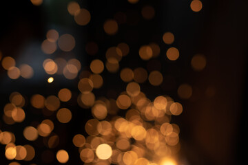 Obraz premium Gold abstract bokeh background, Festive xmas abstract background with bokeh defocused lights and stars 