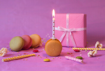 colorful birthday decoration with burning candle