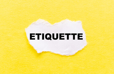 the inscription ETIQUETTE on a white torn piece of paper on a yellow background