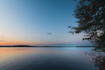 Calm lake water at sunset