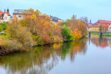 Fototapeta na wymiar Autumn Scenery with Regnitz River in Bamberg Germany 