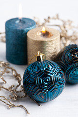Blue and golden aroma candles and Christmas toys