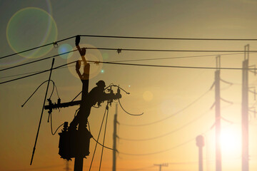 Silhouette person technicians workers on high voltage transmission systems
