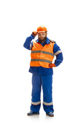 Handsome contractor, builder isolated over white studio background. Concept of professional occupation, work, job, building, investment. Copyspace for ad, text. Caucasian man wearing equipment.