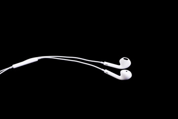 white Headphones on black background