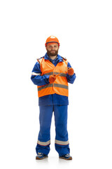 Handsome contractor, builder isolated over white studio background. Concept of professional occupation, work, job, building, investment. Copyspace for ad, text. Caucasian man wearing equipment.