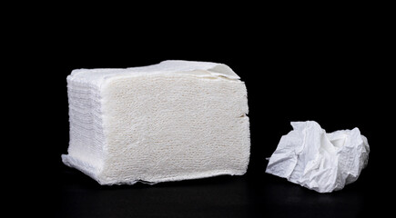 Crumpled tissue paper isolated on black background texture