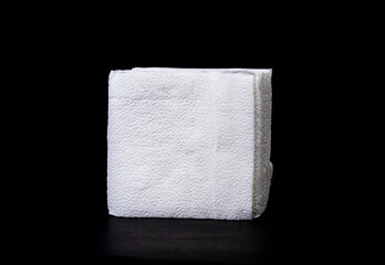 Crumpled tissue paper isolated on black background texture