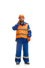 Handsome contractor, builder isolated over white studio background. Concept of professional occupation, work, job, building, investment. Copyspace for ad, text. Caucasian man wearing equipment.