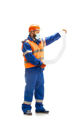 Handsome contractor, builder in face mask isolated over white studio background. Concept of professional occupation, work, job, building, investment. Copyspace for ad, text. Caucasian man wearing