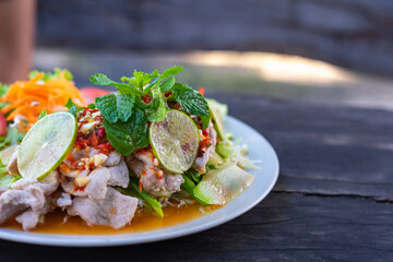 Pork with Lemon spicy sweet sauce thai food.
