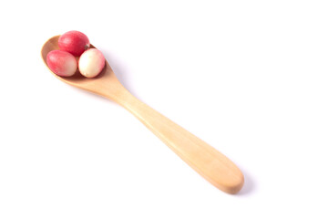 Mango yawning lime in wooden spoon on white background