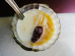 Onam special Vermicelli payasam made of milk in a glass with spoon.