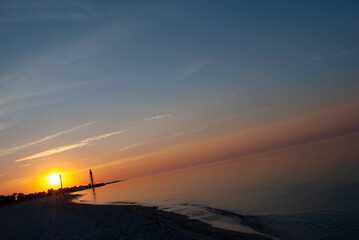 Beautiful sea sunrise with lighthouses. lighthouse on Dzharylgach island, Kherson region. Old lighthouse on the seaside in Ukraine. Beautiful sea sunrise with lighthouses on Dzharylgach island.
