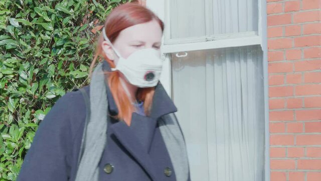 Beautiful woman wearing respiratory mask for the new rapidly spreading Coronavirus, COVID-19