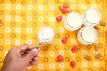  fresh yogurt in a bowl on table cloth background 
