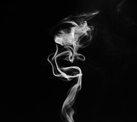 abstract fragment movement of white smoke on black background.