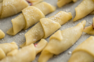 Step-by-step instructions for making bagel cookies preparation for a croissant with jam. Step 4 macro