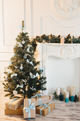 
Decorated Christmas tree and boxes with gifts underneath.