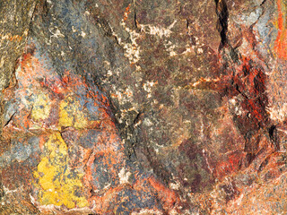 Stone background of mottled granite igneous rock used in construction, as a finishing material for kitchen countertops, etc.