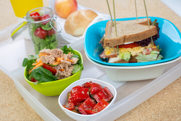 sandwich with egg, bacon and tomato salad with vegetables