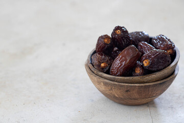 Juicy organic Medjool dates  on  background