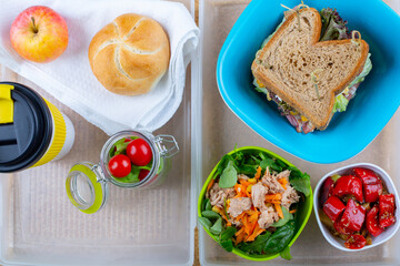 sandwich with egg, bacon and tomato salad with vegetables