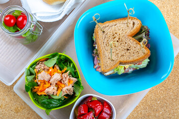 sandwich with egg, bacon and tomato salad with vegetables