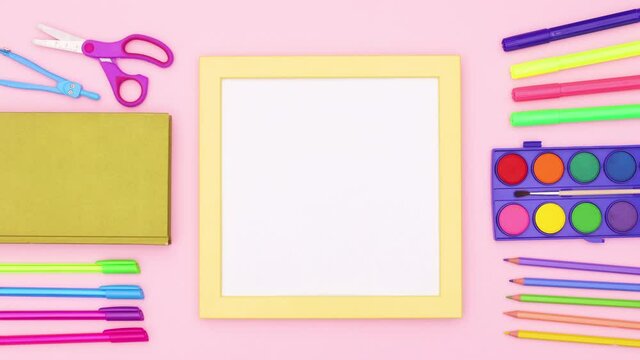 School stationery around yellow frame for text. Stop motion 