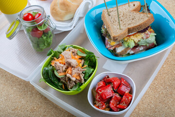 sandwich with egg, bacon and tomato salad with vegetables