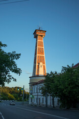 Fototapeta na wymiar Old fire tower (monument of history and architecture of 19th century). Rybinsk, Yaroslavl Oblast, Russia.