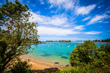 Small bay with boats at the emerald coast in Brittany, France
