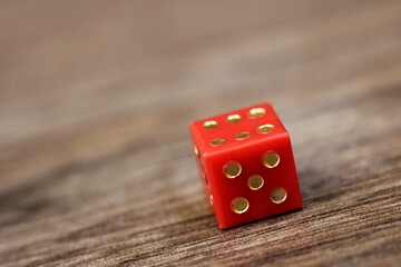 Red dice on a wooden background