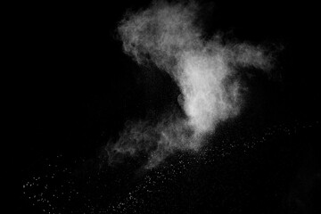 White powder explosion on black background.